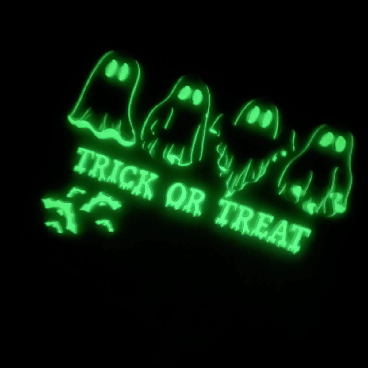 Glow in the dark DTF transfer glowing under UV blacklight on shirt - UploadDTF